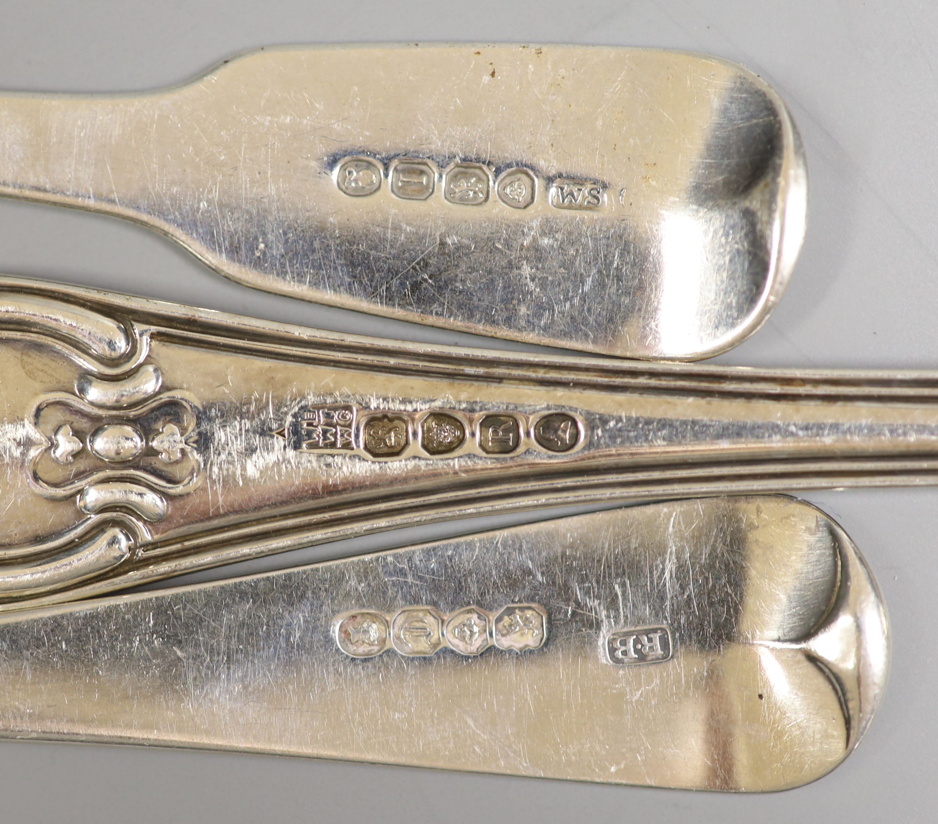 A pair of George III silver hourglass pattern basting spoons, London, 1812, a pair of silver sauce ladles and four Victorian silver tablespoons, 22.5oz.